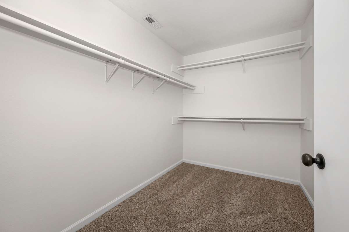 Walk-in closet in the primary