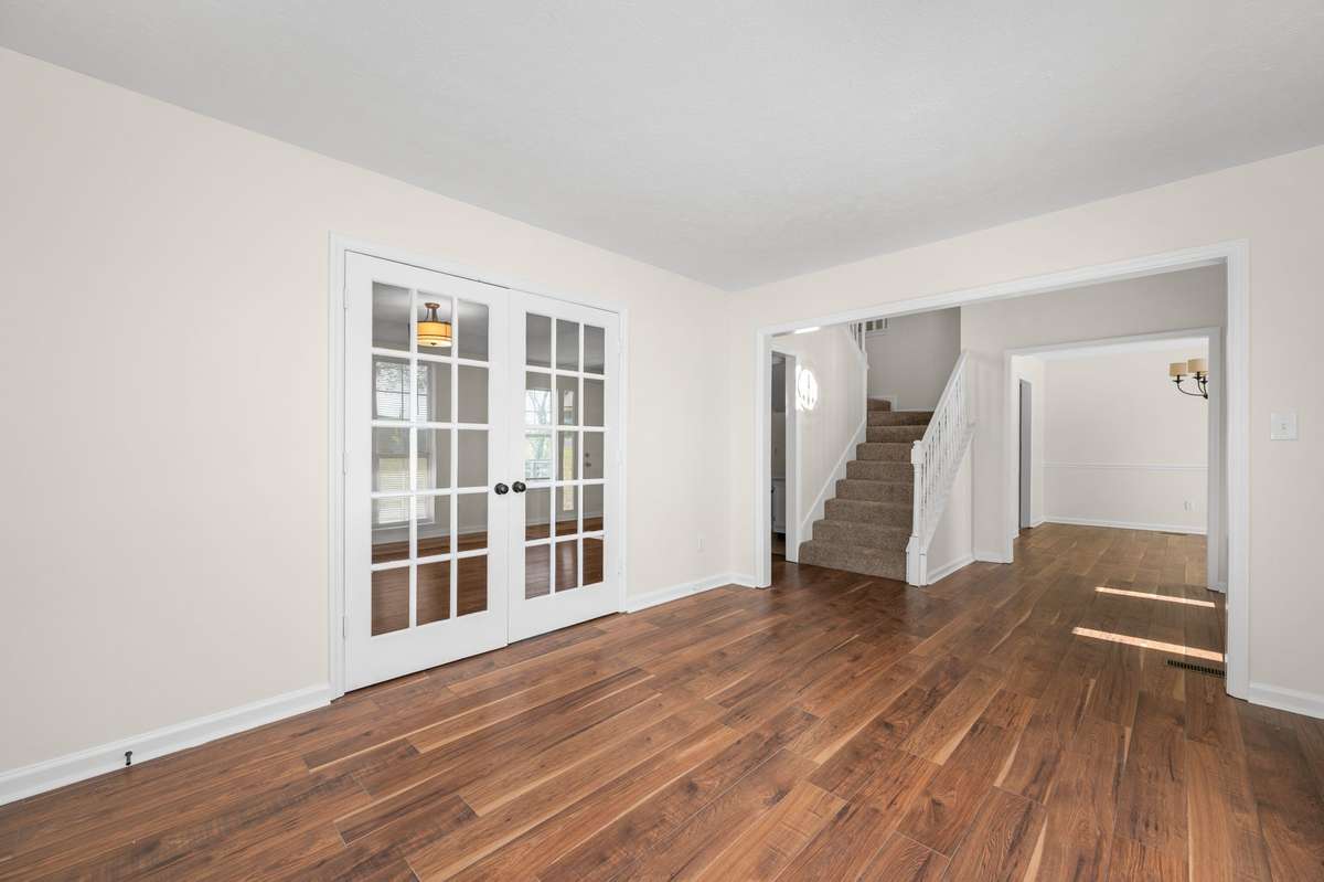 Formal living (or flex room) view toward dining room on opposite side of entry.
