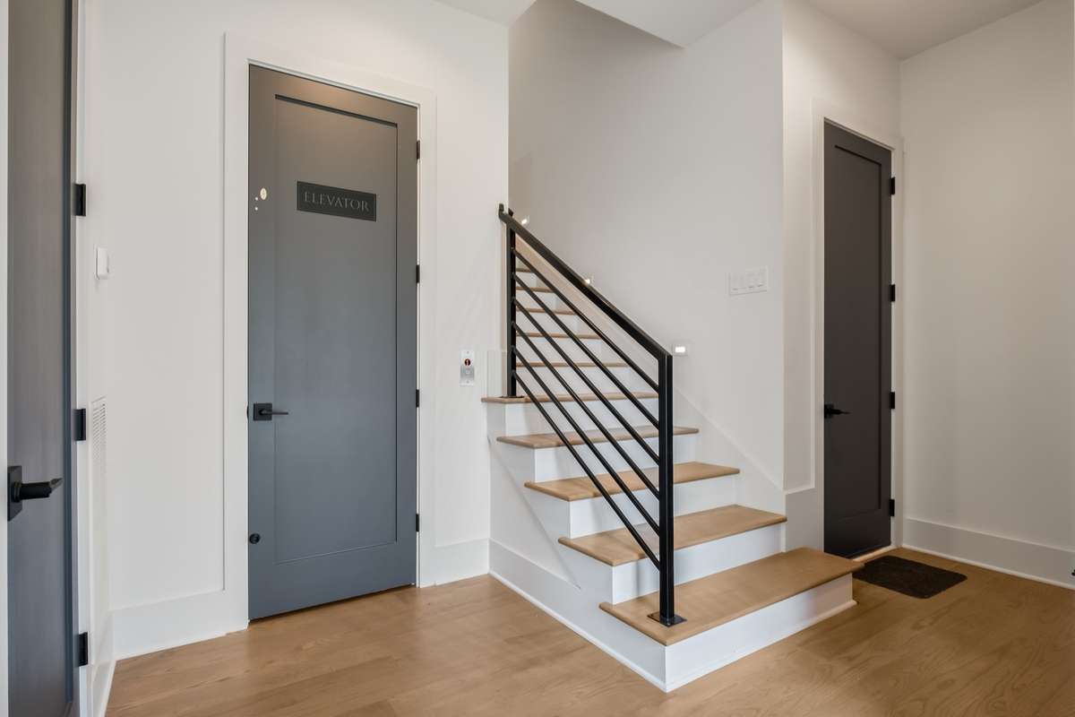 Elevator access to all levels adds luxury and convenience - with designer stair detailing to complement.