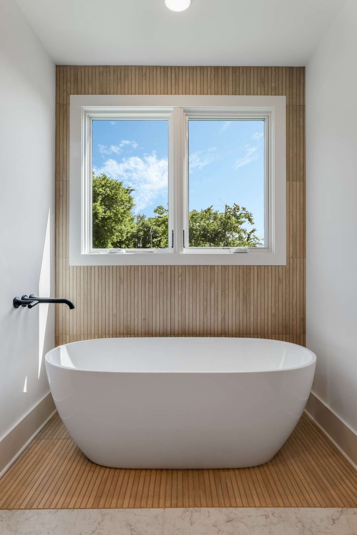 Unwind in your personal spa with a freestanding tub, oversized walk-in shower, and luxury finishes throughout.