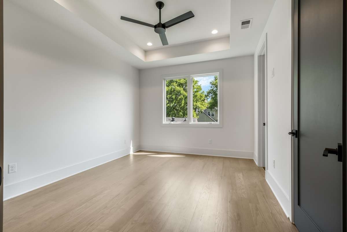 Another light-filled bedroom offering privacy, space, and luxury touches throughout.