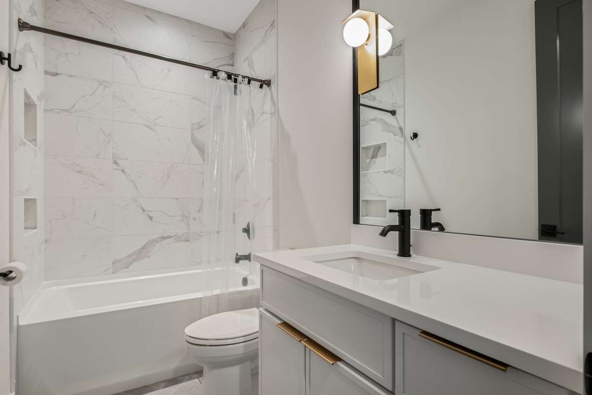 Each bathroom throughout the home features custom tilework, high-end fixtures, and thoughtful design - every space feels elevated and intentional.