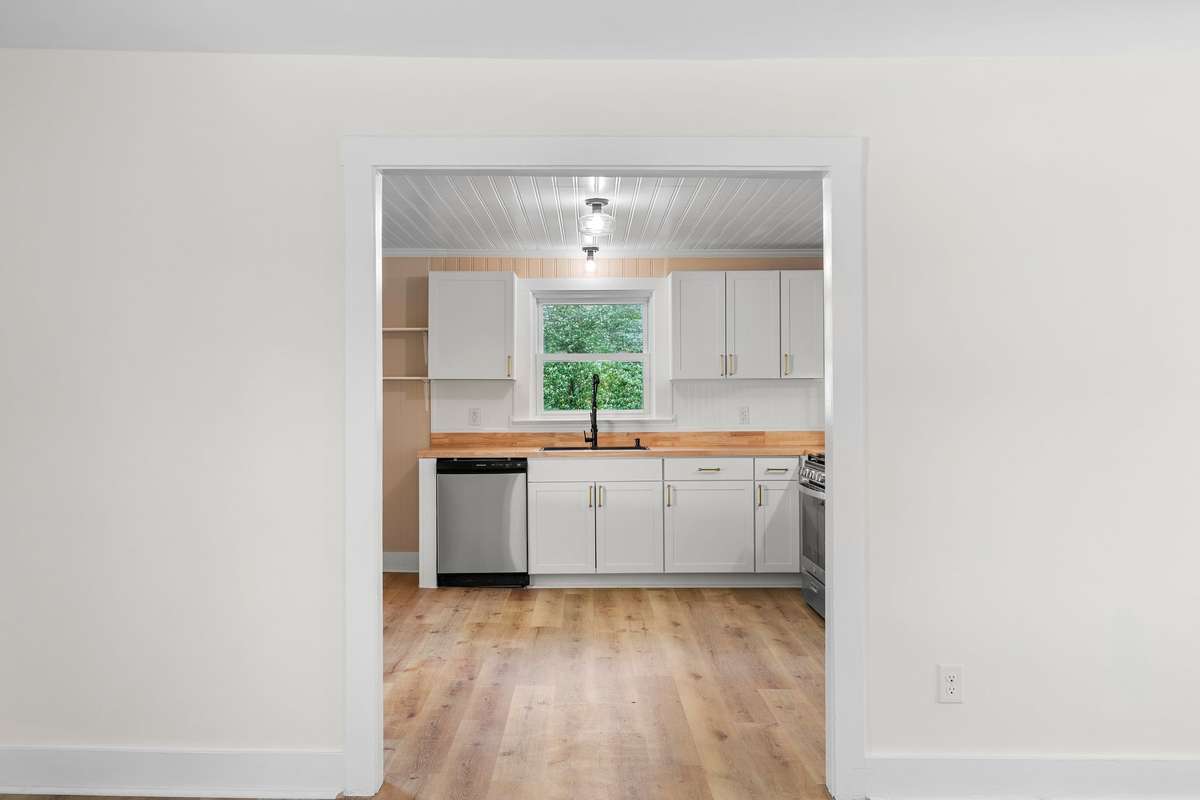 Window over the sink overlooking the lush backyard!