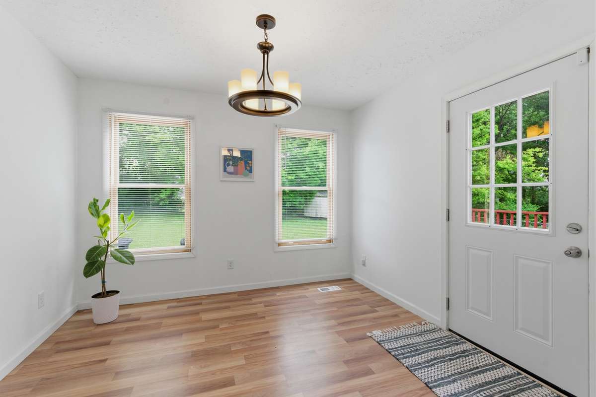 Dedicated dining room facing the backyard, just off of the freshly painted deck.