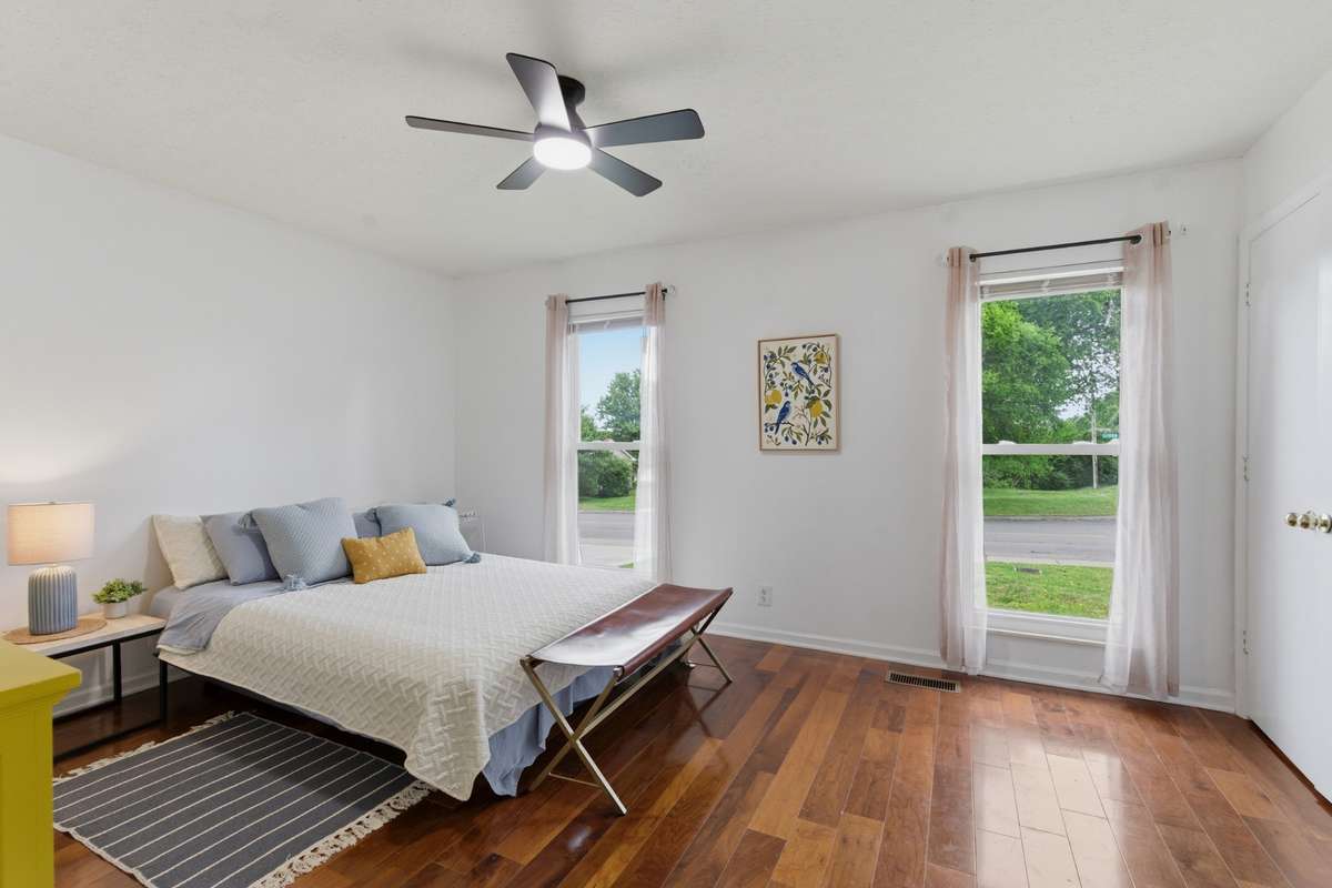 The primary features an en-suite bathroom and double closets.