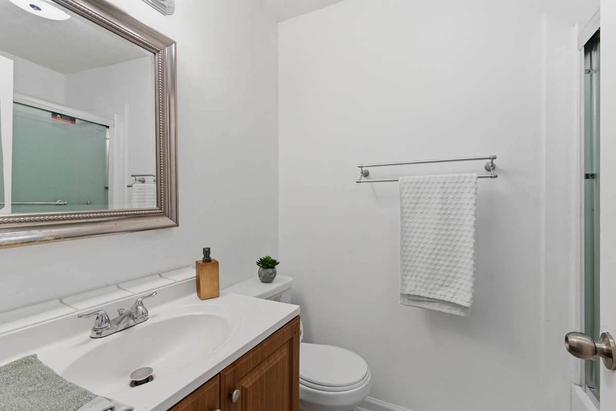 2nd bathroom located in the hallway features a shower/tub combo.