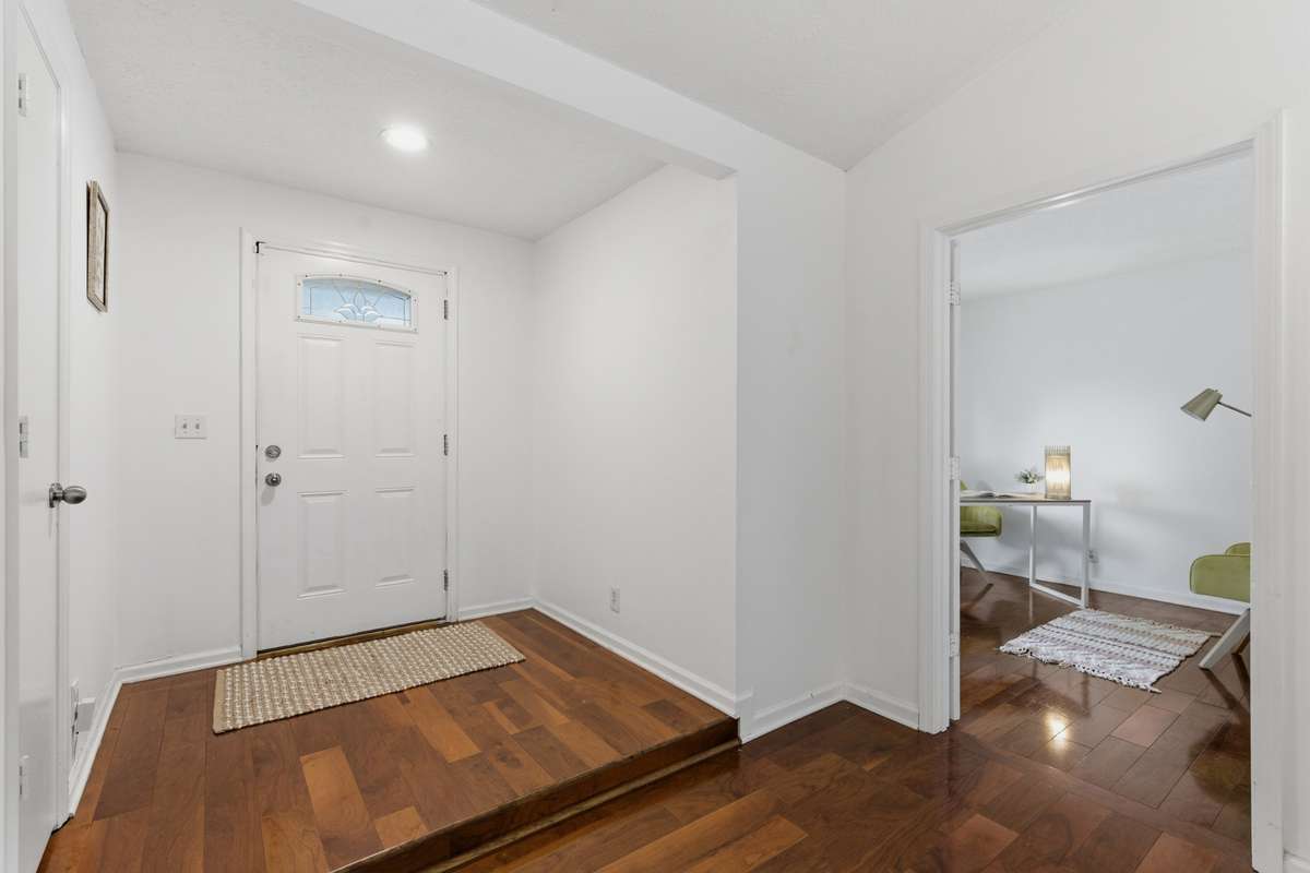Just off the front entrance is a perfect 3rd bedroom or office. Also at the front door is a coat closet for extra storage.