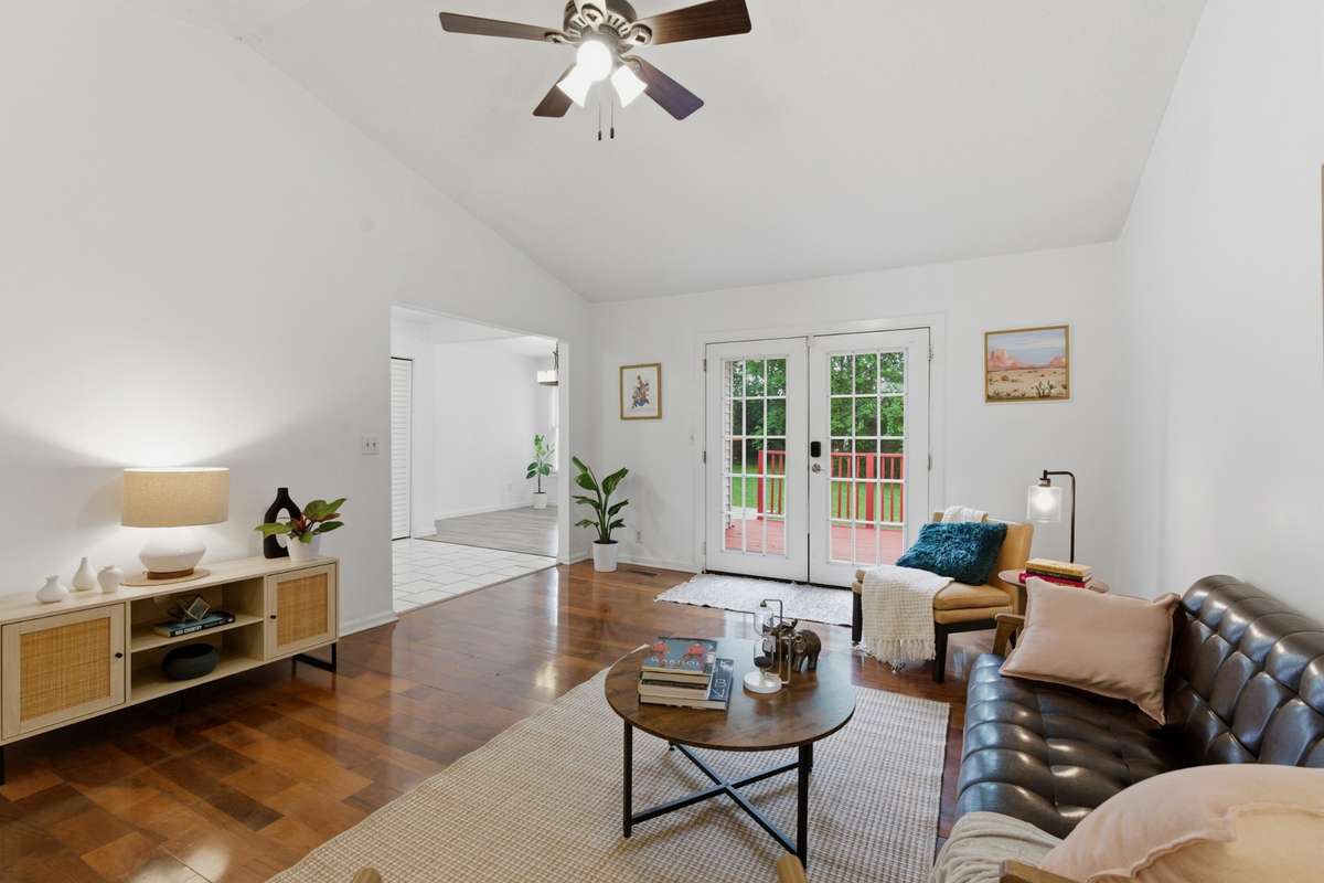 Seen in the back is the kitchen and dining room.