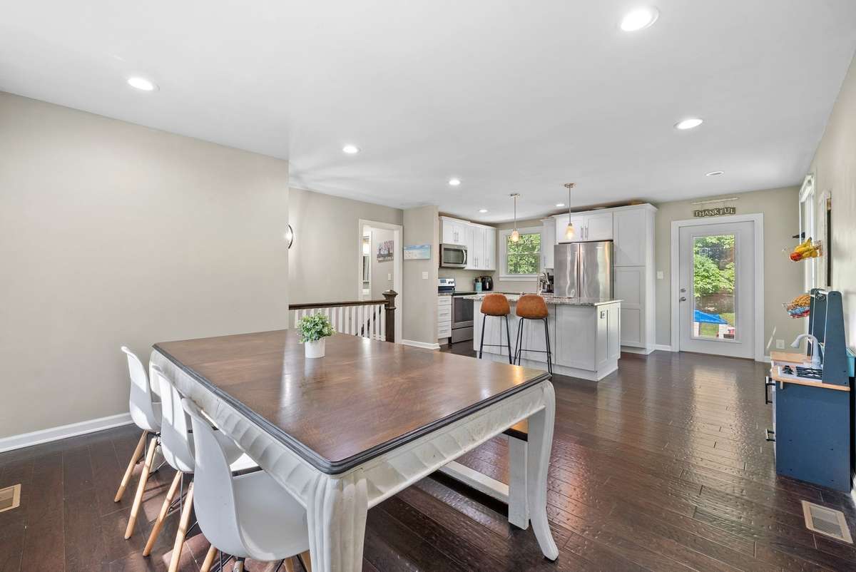 Another view of the upstairs space, currently being used as a dining room. See the next picture for an alternate option.