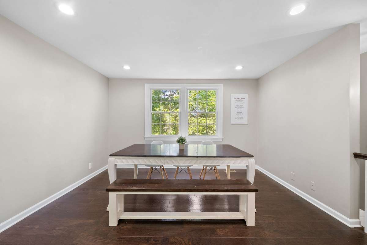 The current owners use this upstairs space for a dining room. See the next picture for an alternate option.