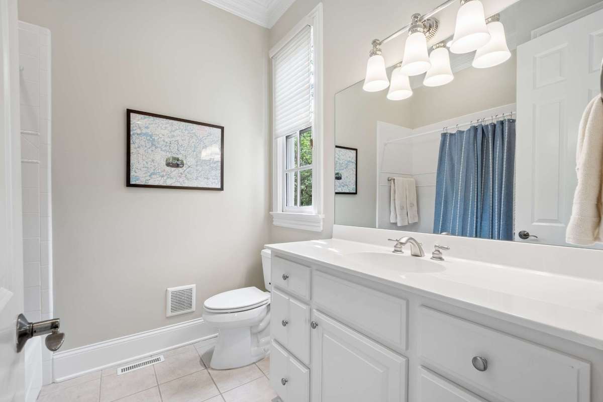 En-suite Bathroom for Bedroom #2 has a large vanity and a tub/shower combination.