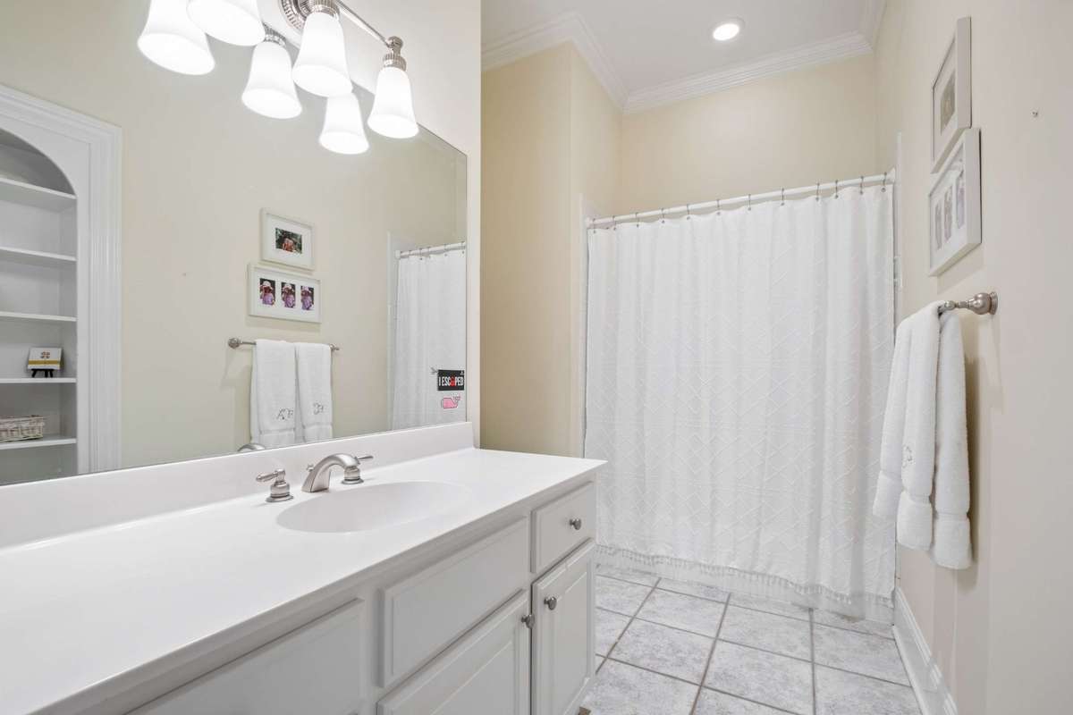 En-suite Bath for Bedroom #4 has a large vanity and tub/shower combination.