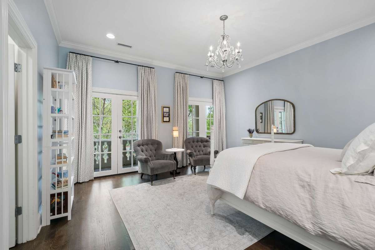 Bedroom #5 has French Doors leading to the front balcony and a walk-in closet.