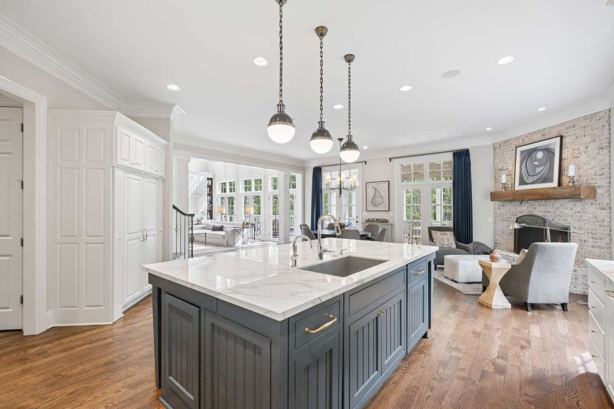 The Kitchen is large enough for a separate dining area and sitting area. It opens to the Living Room and Screened Porch creating a seamless flow.