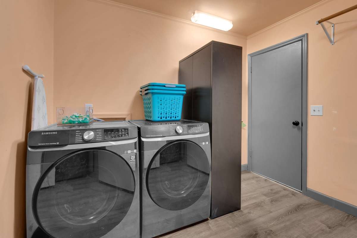 Laundry room (12x10) - Great storage! This room can accommodate an extra refrigerator, storage shelving, and more.