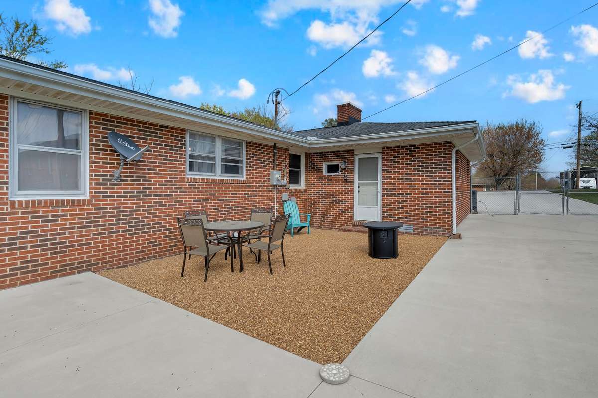 Back patio in fenced yard.