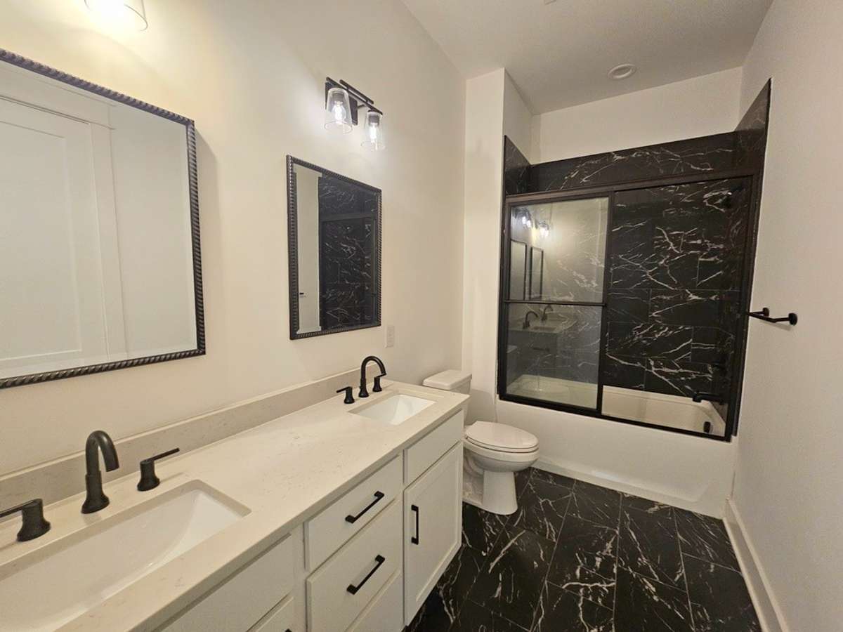 Full bathroom located off the 2nd bedroom and entertainment area.