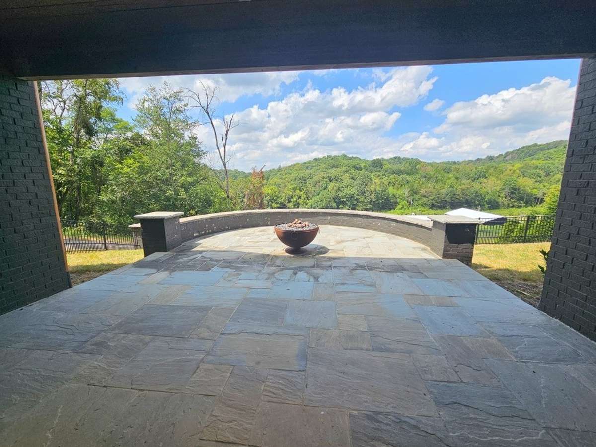 Patio with gas firepit located off of the lower level entertainment area with the same gorgeous views.