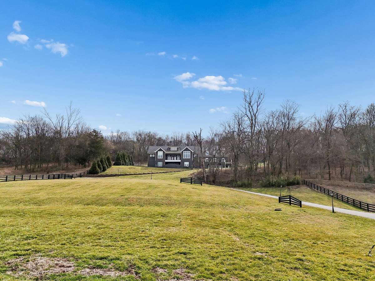 6720 Lane Rd on gated lot with 6.91 acres.