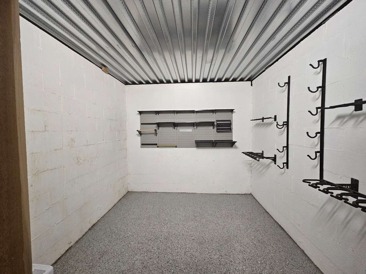Safe room located on lower level accessible through Utility room. Keypad with secure code lock and key lock.