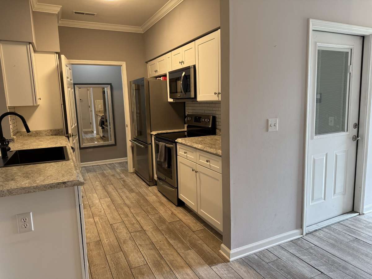 Garage Door entrance to the right. Kitchen through to Pantry/Landry Room