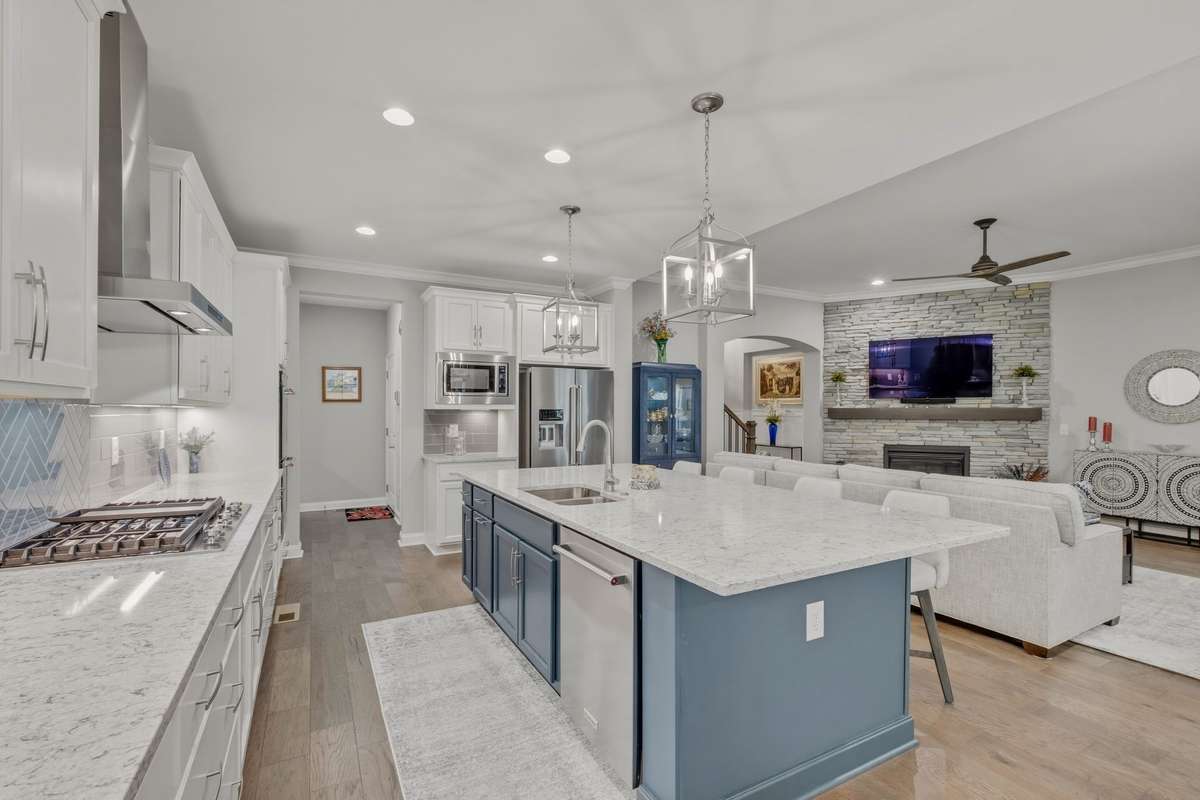 Another view of the stunning kitchen with the gas stovetop.  There are even convenient and useful outlets on each side of the center island.