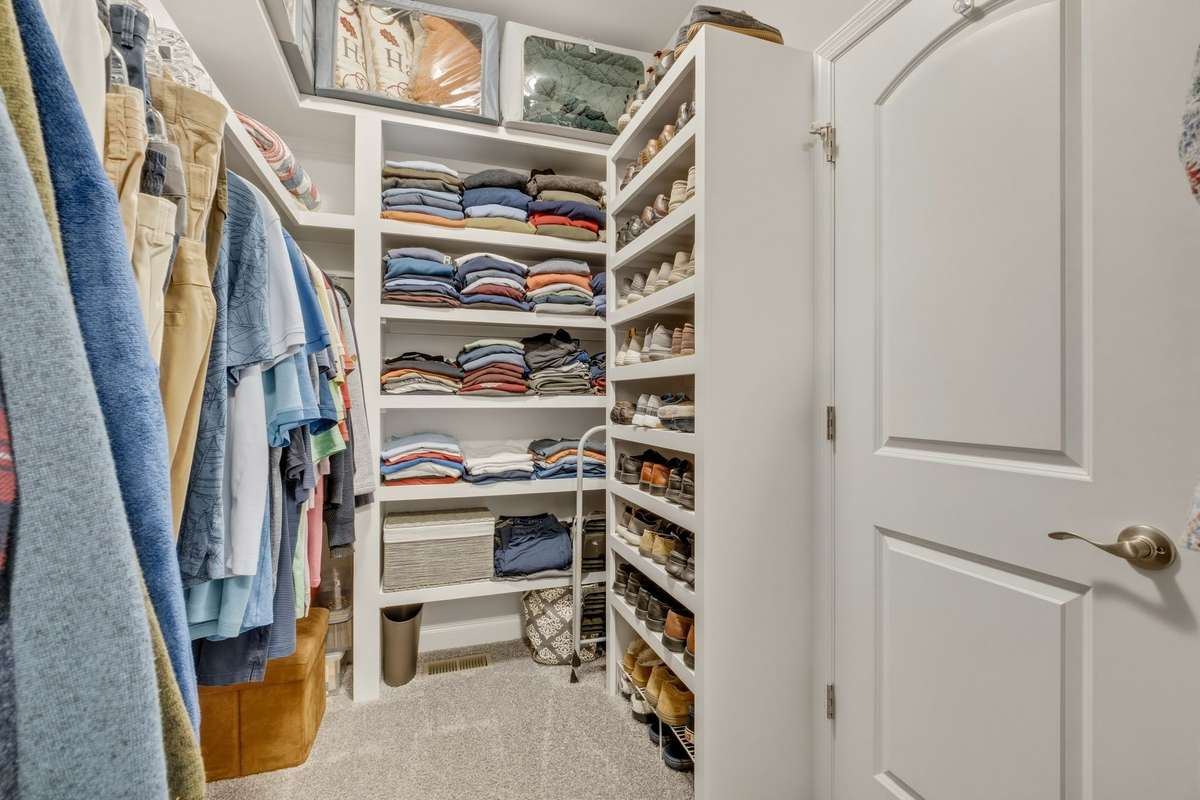 Once again, incredible built-ins in the walk-in master closet.  You never have to worry about clothing racks falling down again - a really elevated upgrade in this home.