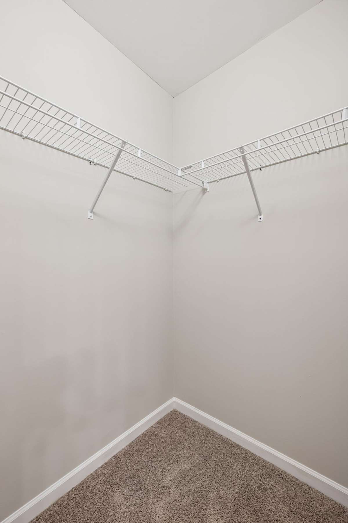 One of two walk-in closets in Primary Bedroom