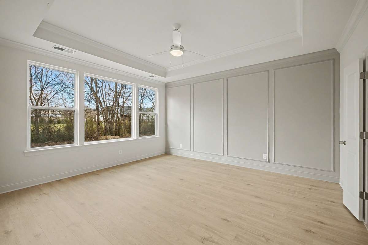 Primary bedroom with panel details