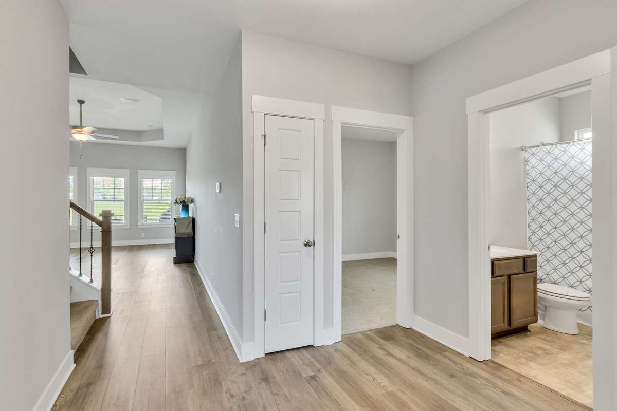 To the right of foyer you have 2 bedrooms and a full bath