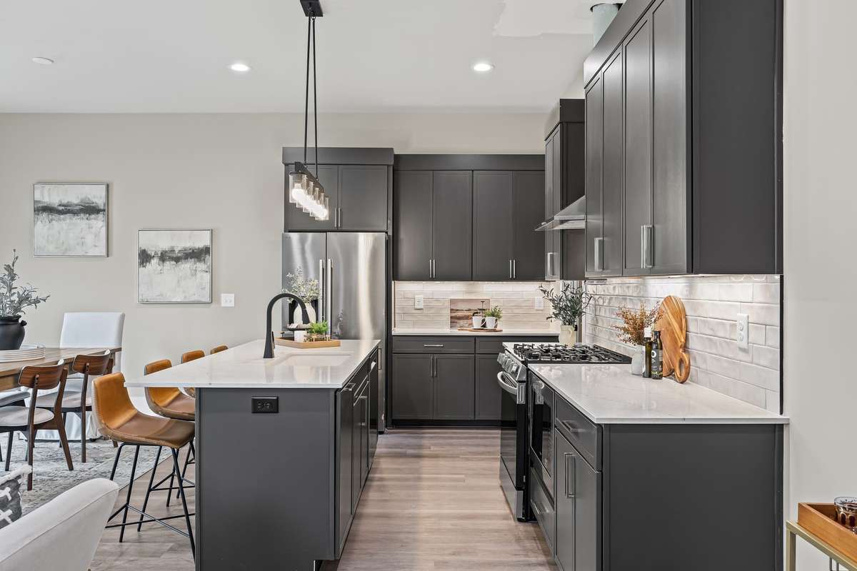 Junipers Beautiful Open Kitchen Floor Plan with Designer Fixtures: Quartz Countertops & Custom Cabinets