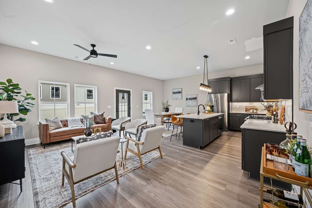 Spacious Living and Dining Area with 10 ft ceilings and 8 ft doors leading into a backyard which can be fenced.