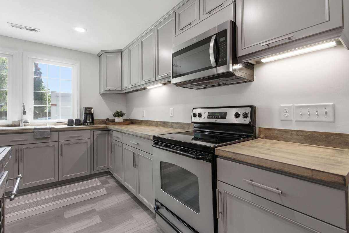 Newly refinished and sealed 2” butcher block kitchen countertops