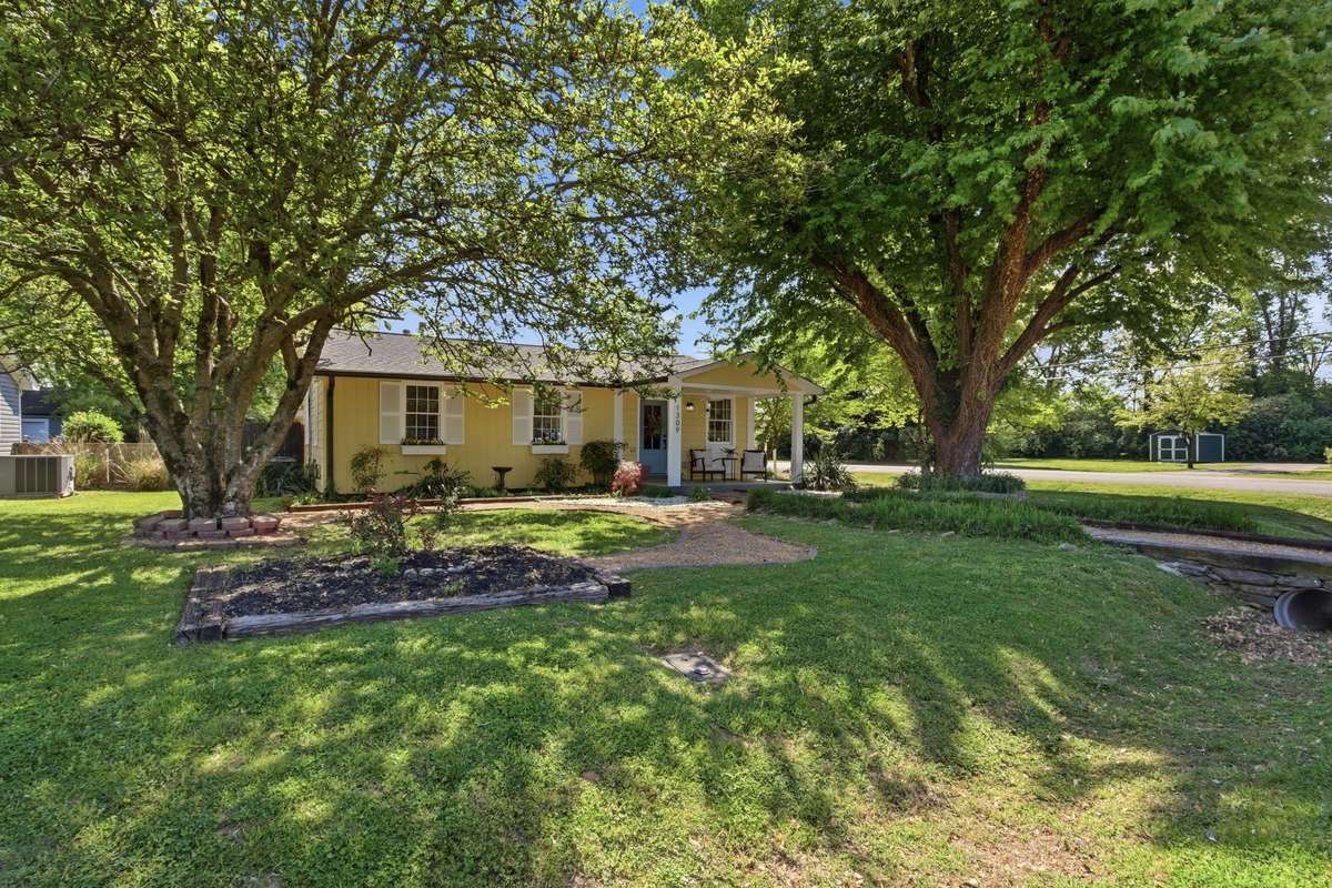 Shady front yard on corner lot 1 mile from downtown Franklin and a quick walk to restaurants and shops.