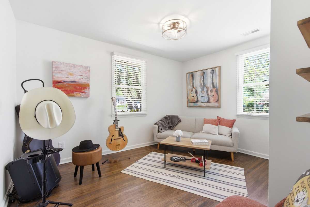 One of 4 bedrooms, hardwood floors and 2 windows