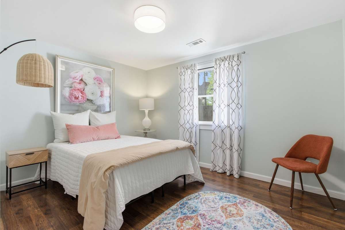 Bedroom #4 with window, new ceiling light and LVP flooring