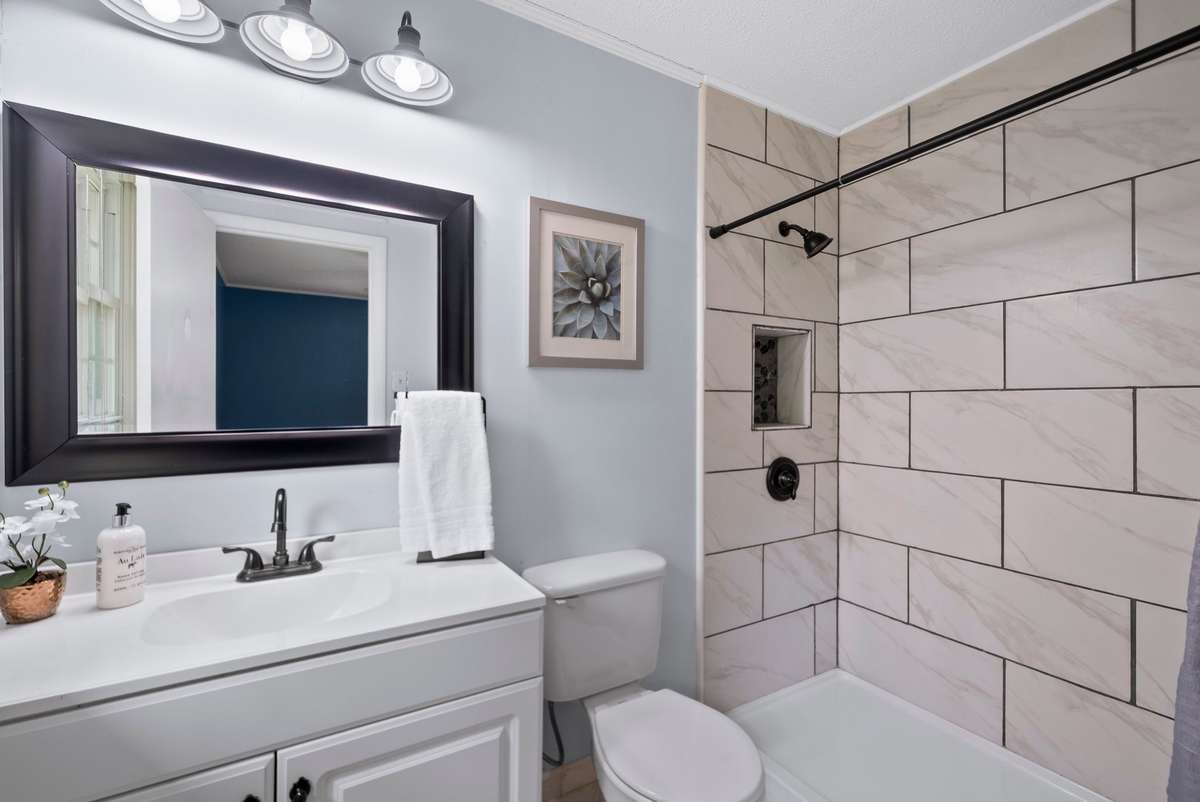 Gorgeous primary bathroom with a tile shower.