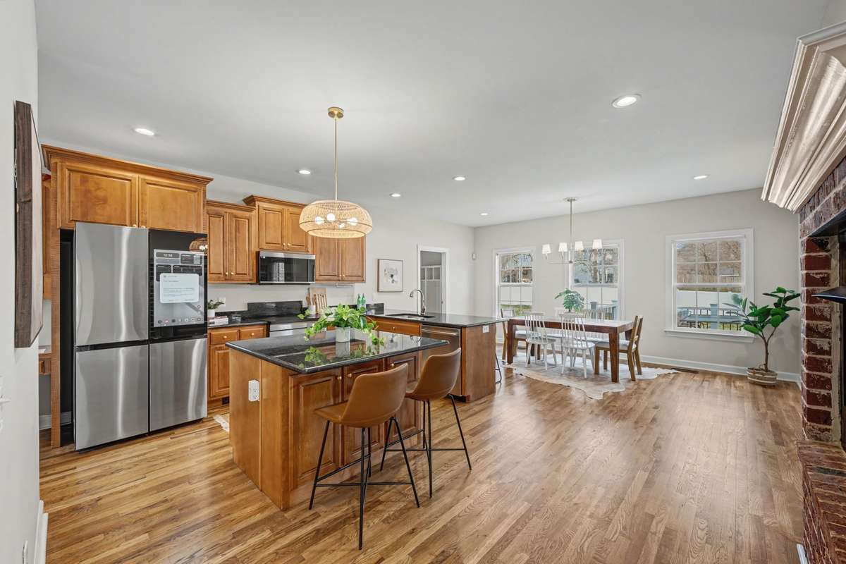New kitchen with top of the line Induction energy-efficient appliances, updated hardware, new hardwood floors, gas fireplace and freshly painted