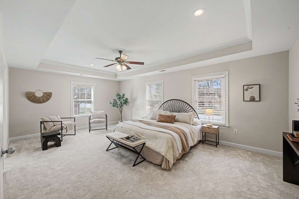 Huge Owners Suite showcasing new paint, flooring, and a lot of natural light