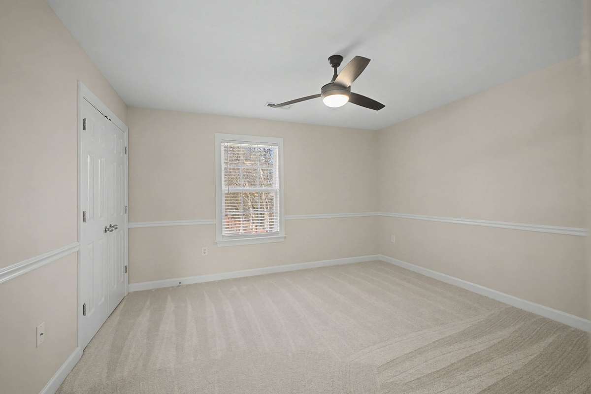 Guest Bedroom with new fan, flooring, paint and attached bathroom
