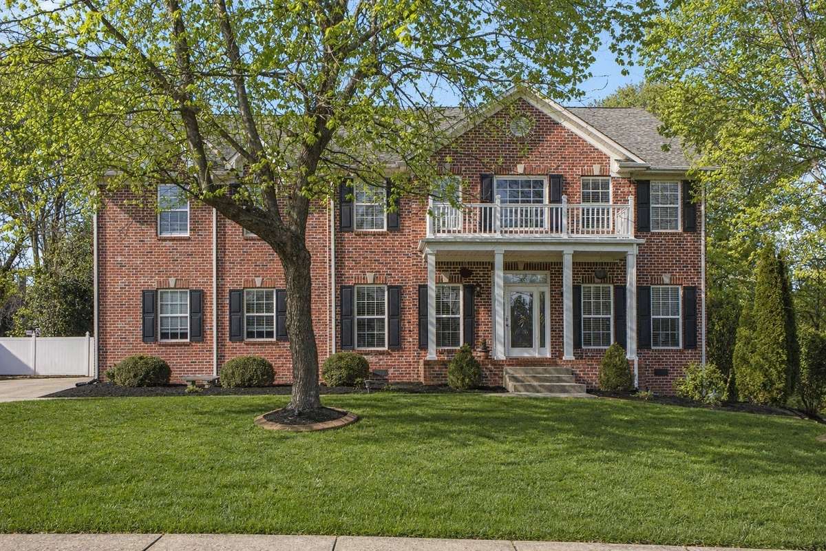 Beautifully positioned in the highly coveted Campbell Station community of Williamson County, this all-brick residence offers timeless curb appeal with a stately façade, fresh landscaping, and a welcoming covered front porch.