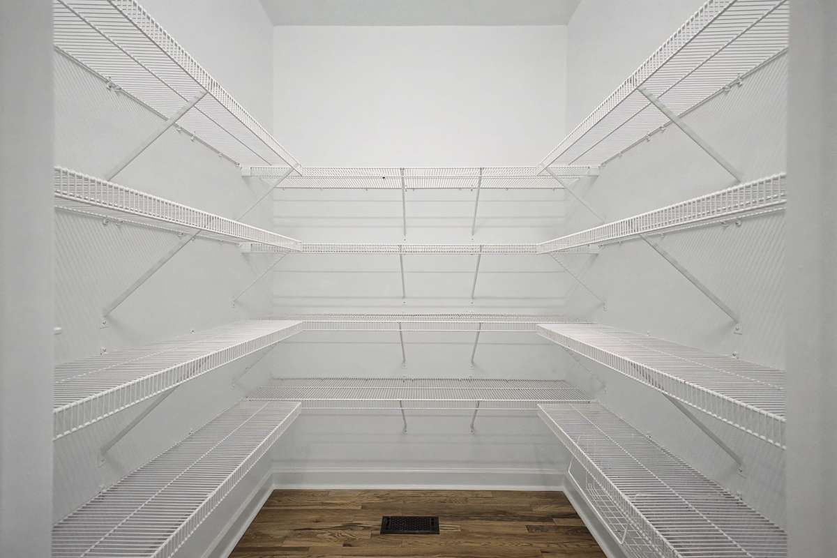 Freshly painted entry with new hardwoods and large pantry