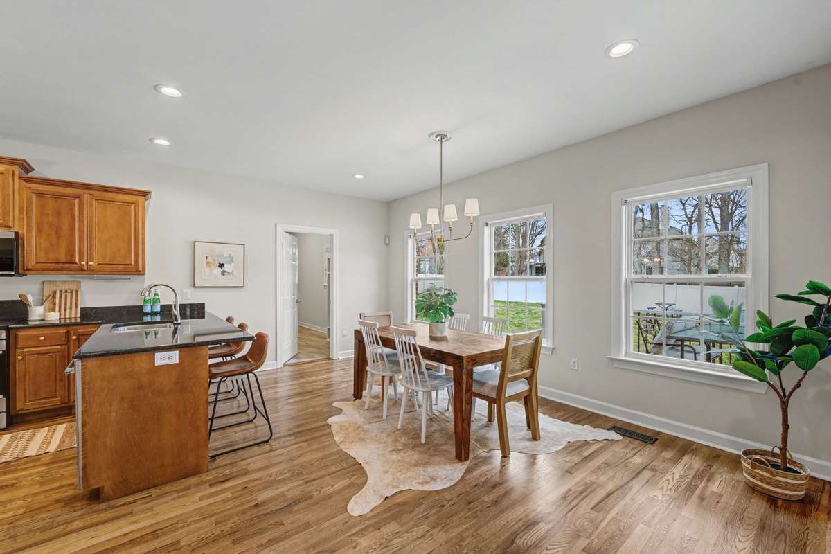 Large eat in kitchen, granite countertops with lots of bar seating and natural light.  Perfect setting for all.