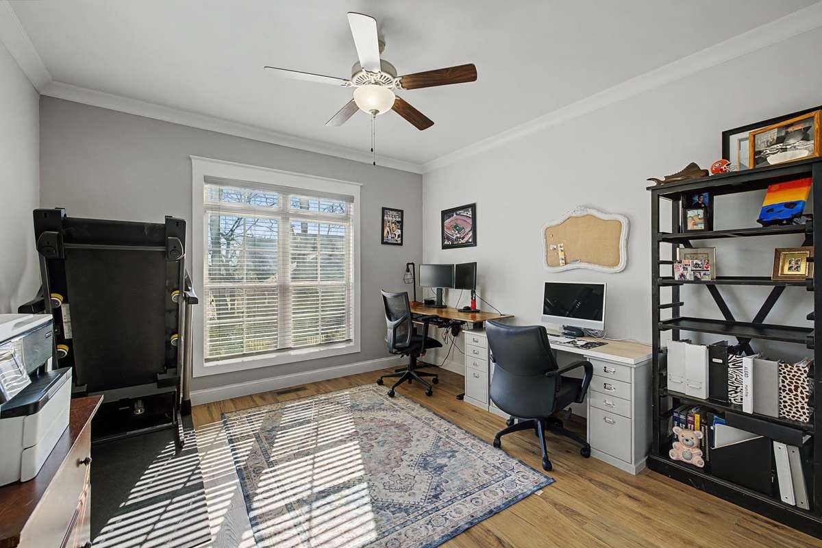 Secondary bedroom on the main level currently being used as a home office.  Full bathroom right outside the door.