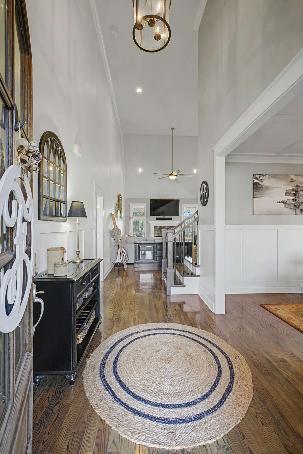 Welcome Home! Beautiful entryway opens to the formal dining, open concept family room and kitchen with soaring ceilings.