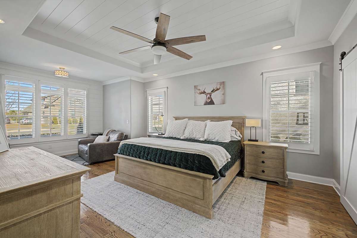 Large primary suite with plantation shutters.