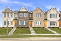 Second townhome from the left. All brick!