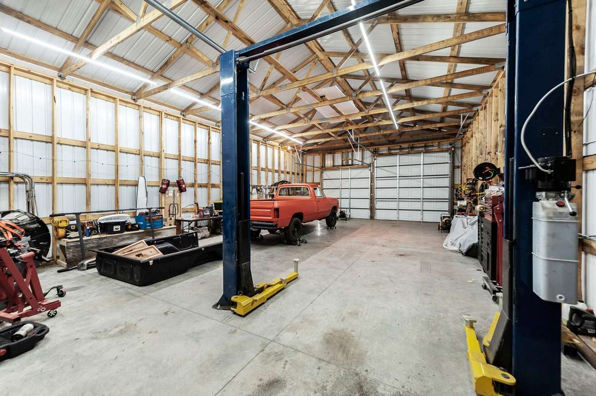 30x50 garage with 14 ft tall walls big enough for your dump truck or RV.  This garage has a separate 200-amp meter with 220 wiring.  The Lift stays with the property!