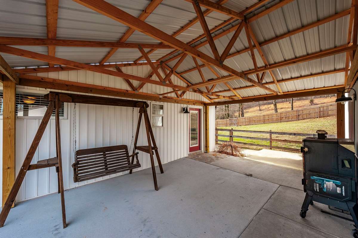 You will enjoy the covered breezeway between the 30x30 detached garage and the house.
