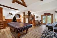 Walkout basement game room. Pool table stays